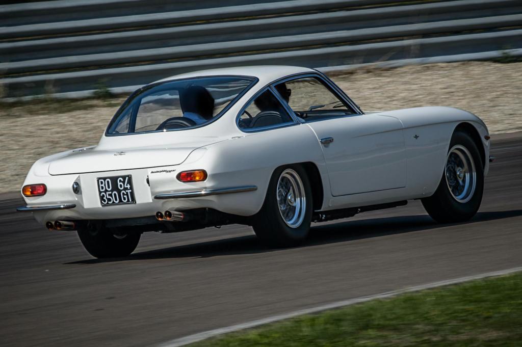 An image of a Lamborghini 350GT driving around on a track.