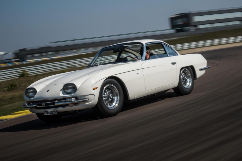 An image of a Lamborghini 350GT driving around on a track.