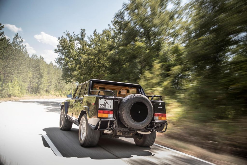 An image of a Lamborghini LM002 out on the road.
