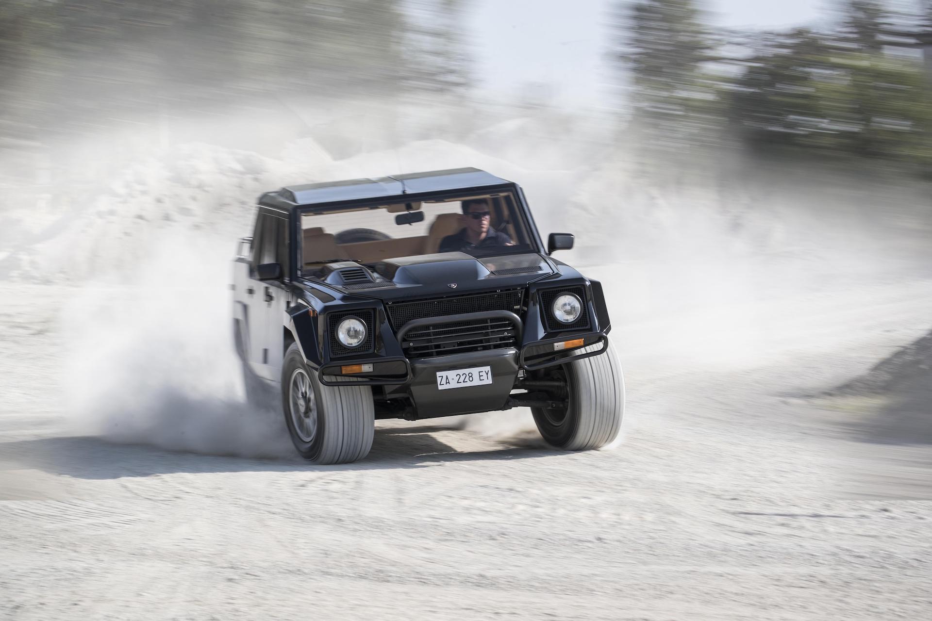 An image of a Lamborghini LM002 out on the road.
