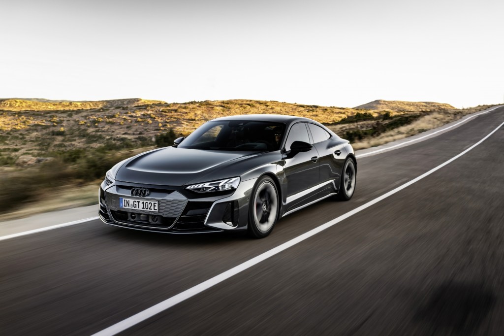 A gray Audi E-Tron GT driving down the road