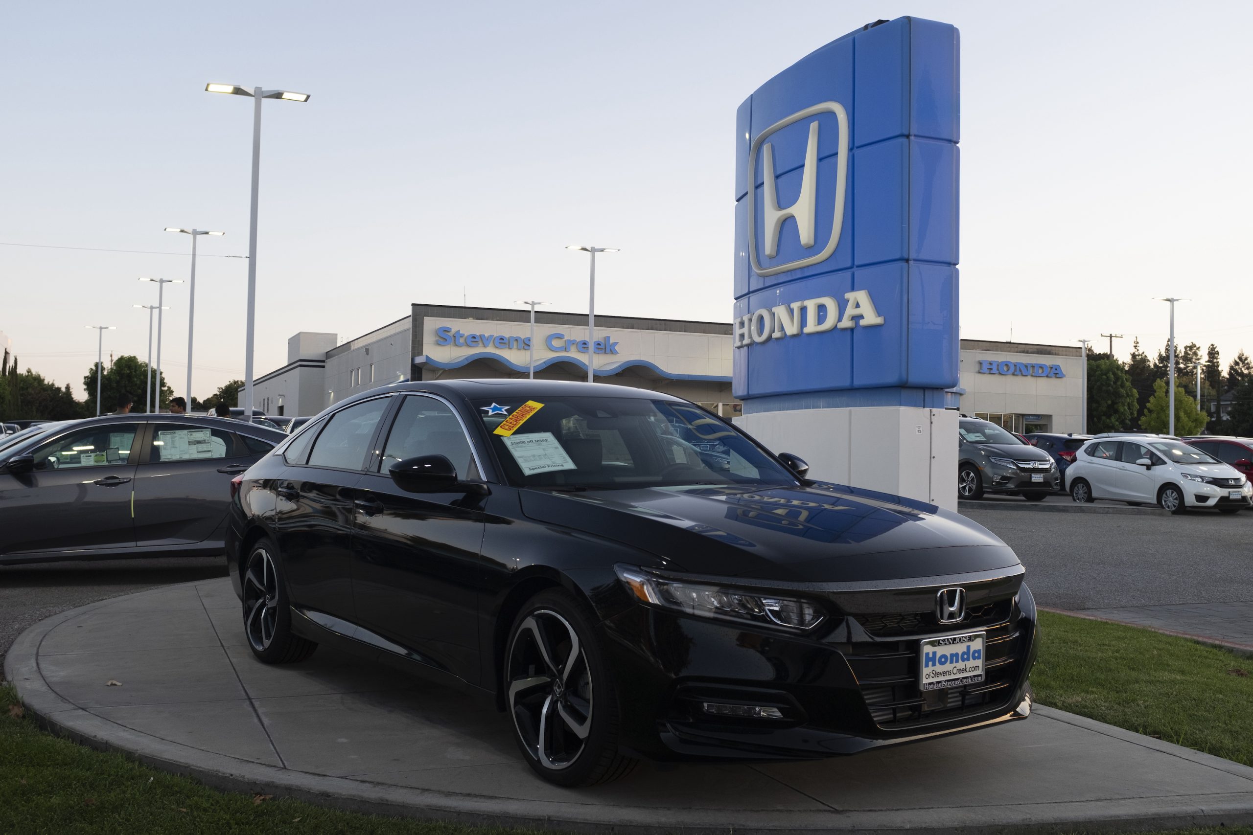 Honda logo and Honda Accord vehicle are seen at a store in San Jose, California on August 27, 2019