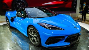 A blue Chevy Corvette on display at an auto show