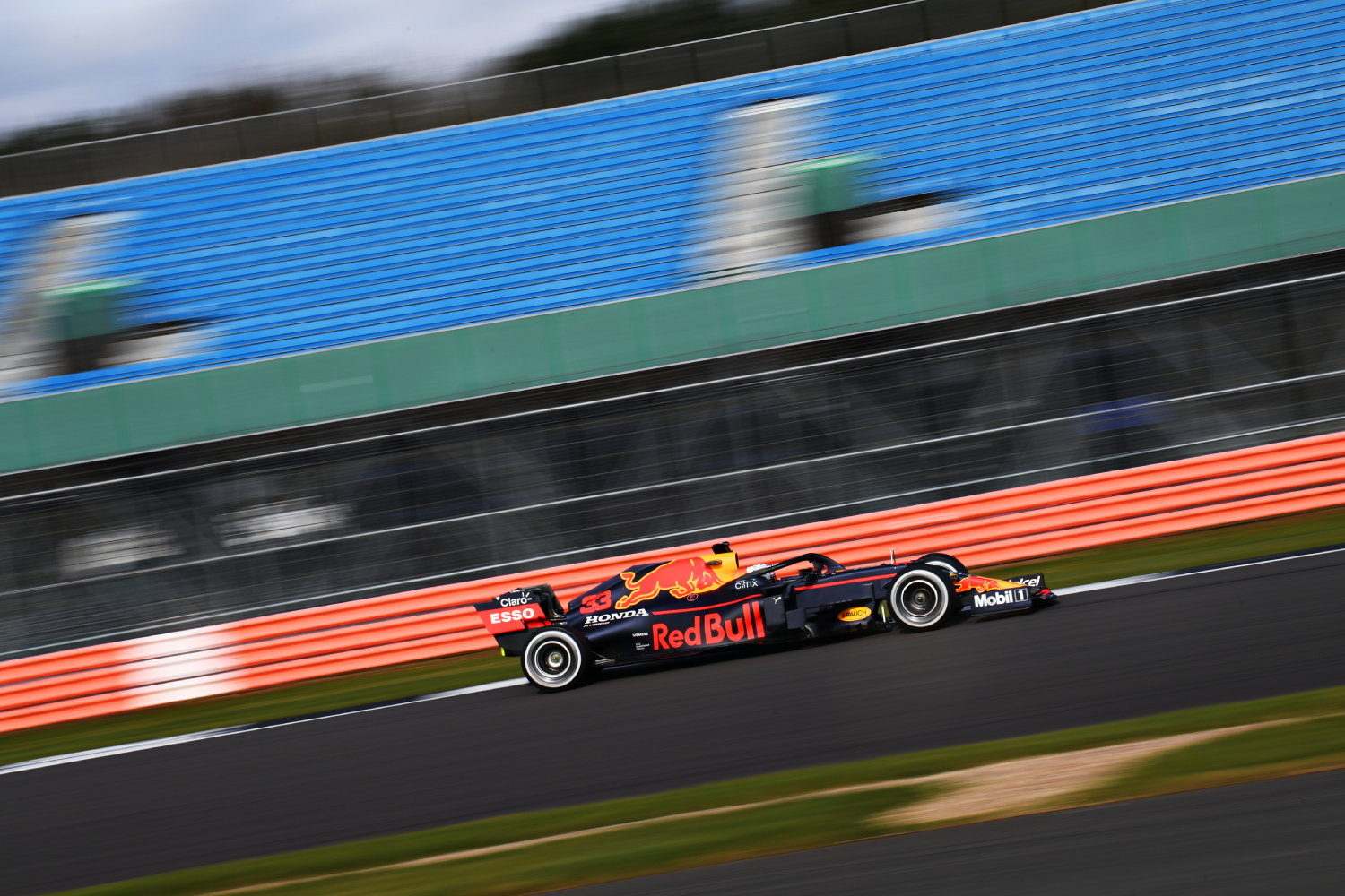 A Red Bull Racing Formula 1 car driving down the track.
