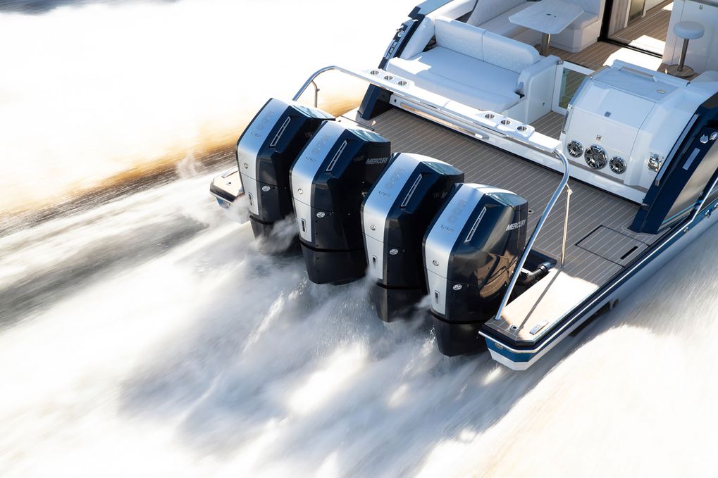 an elevated view of a boat at speed running four verado outboard motors 