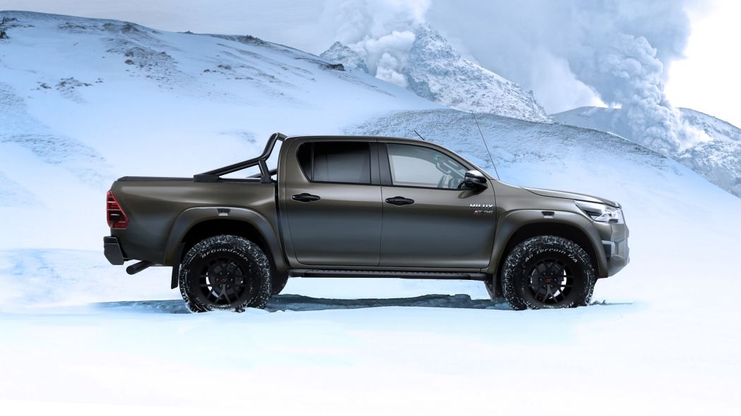 a side photo of the AT35 Toyota Hilux unit in a remote landscape covered in snow