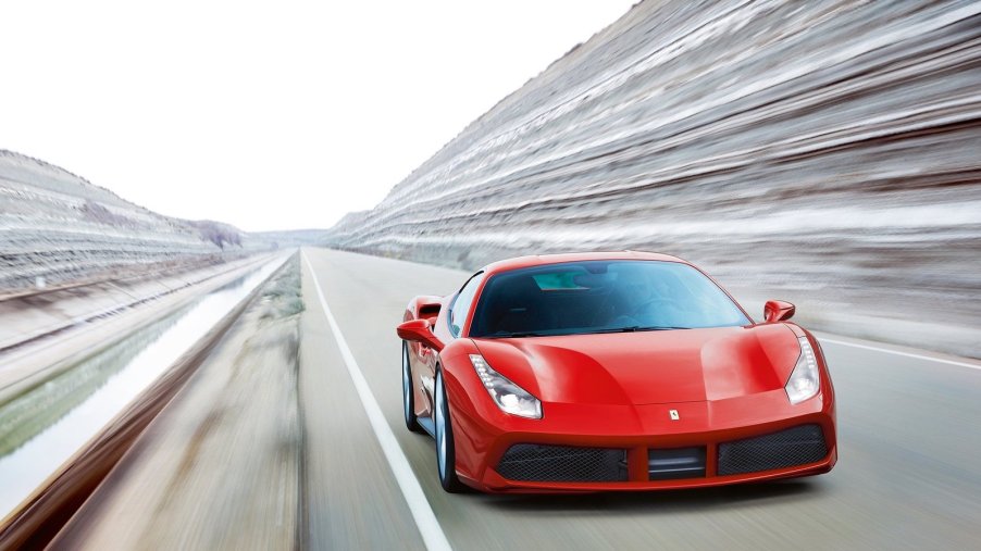 An image of a red Ferrari 488 GTB on a race track.