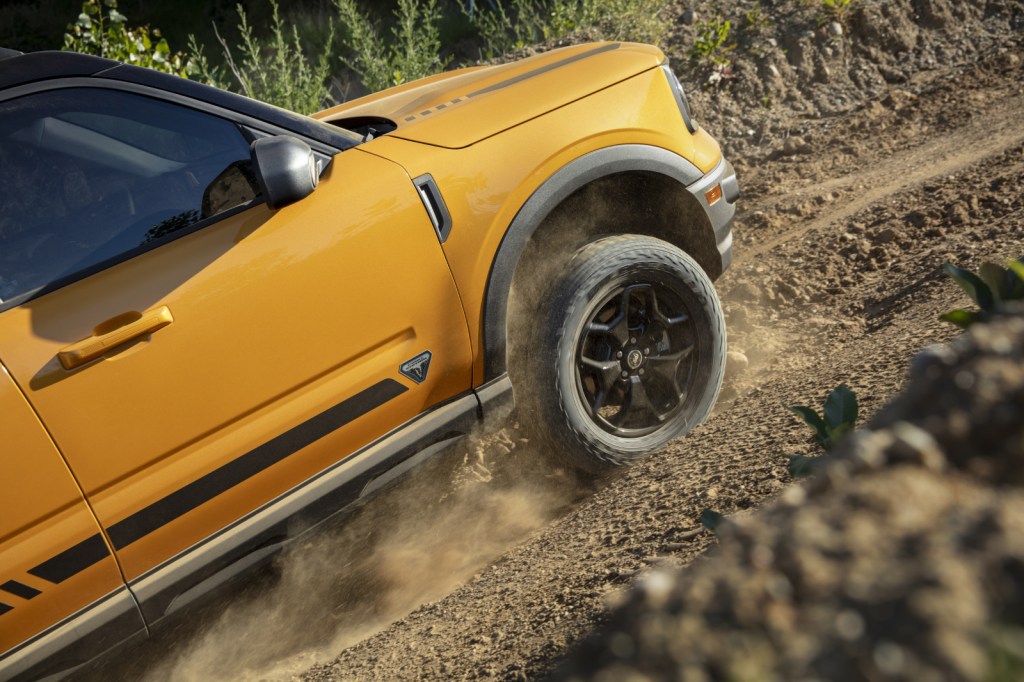 Yellow 2021 Ford Bronco Sport driving uphill