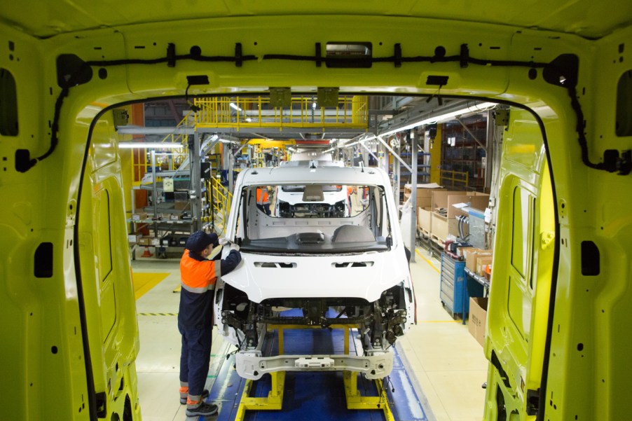A worker assembles a Ford Transit van