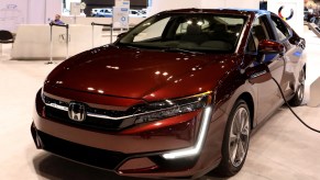 A Honda Clarity Plug-In Hybrid on display at an auto show