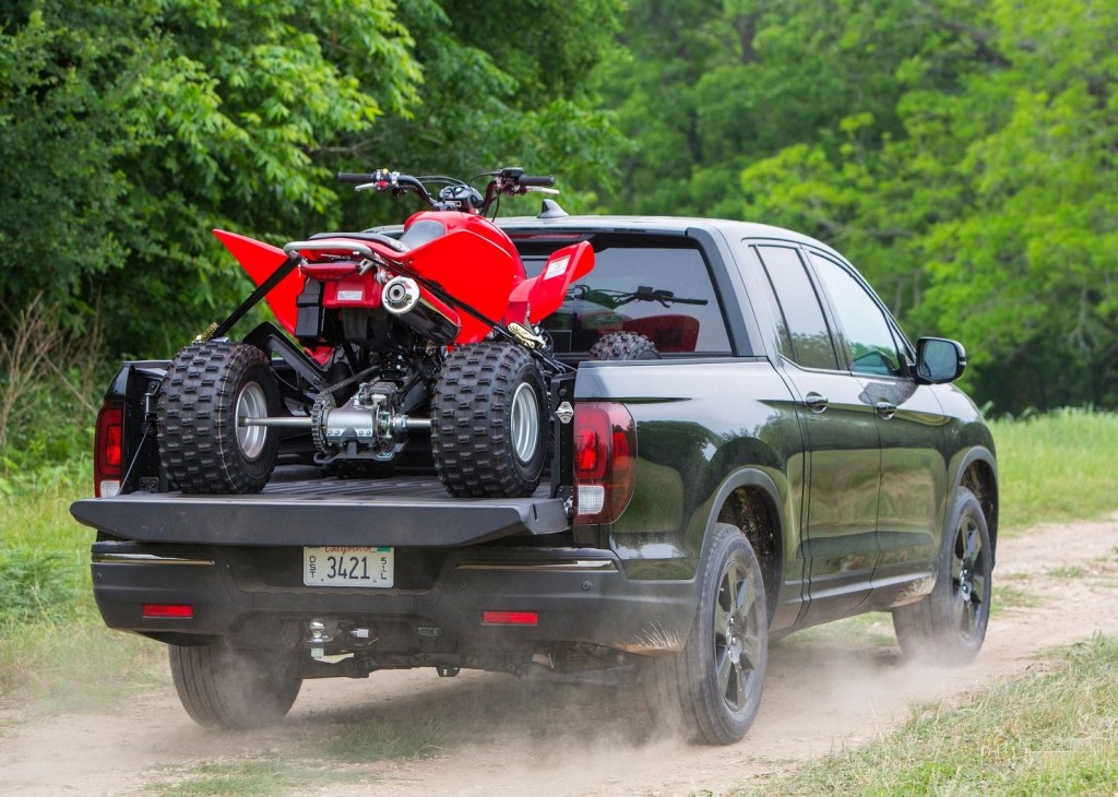 2017 Honda Ridgeline Black Edition hauling an ATV