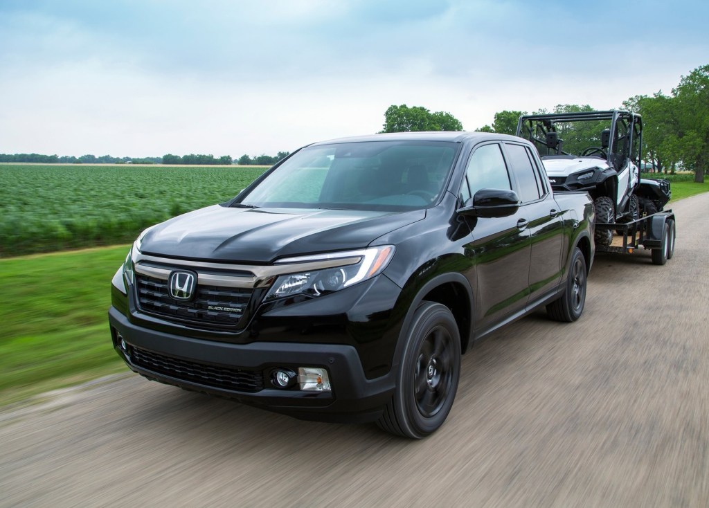 2017 Honda Ridgeline Black Edition towing an ATV