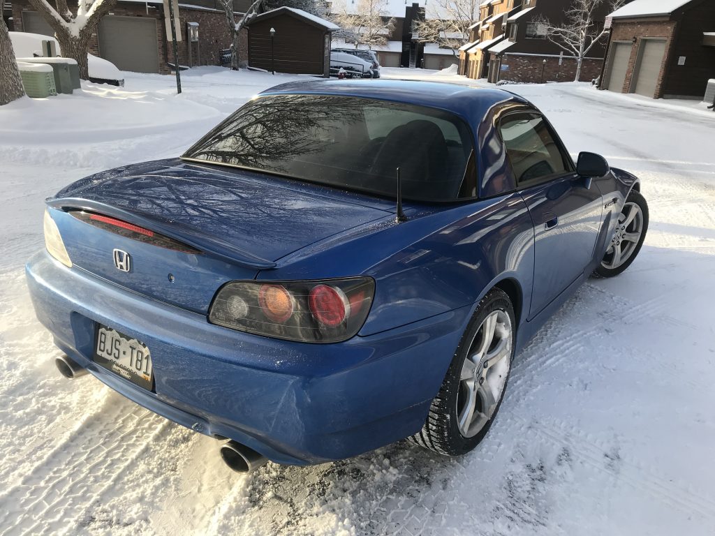 Michelin Pilot Sport All Season tires on a Honda S2000. A rear shot of the car in the snow.
