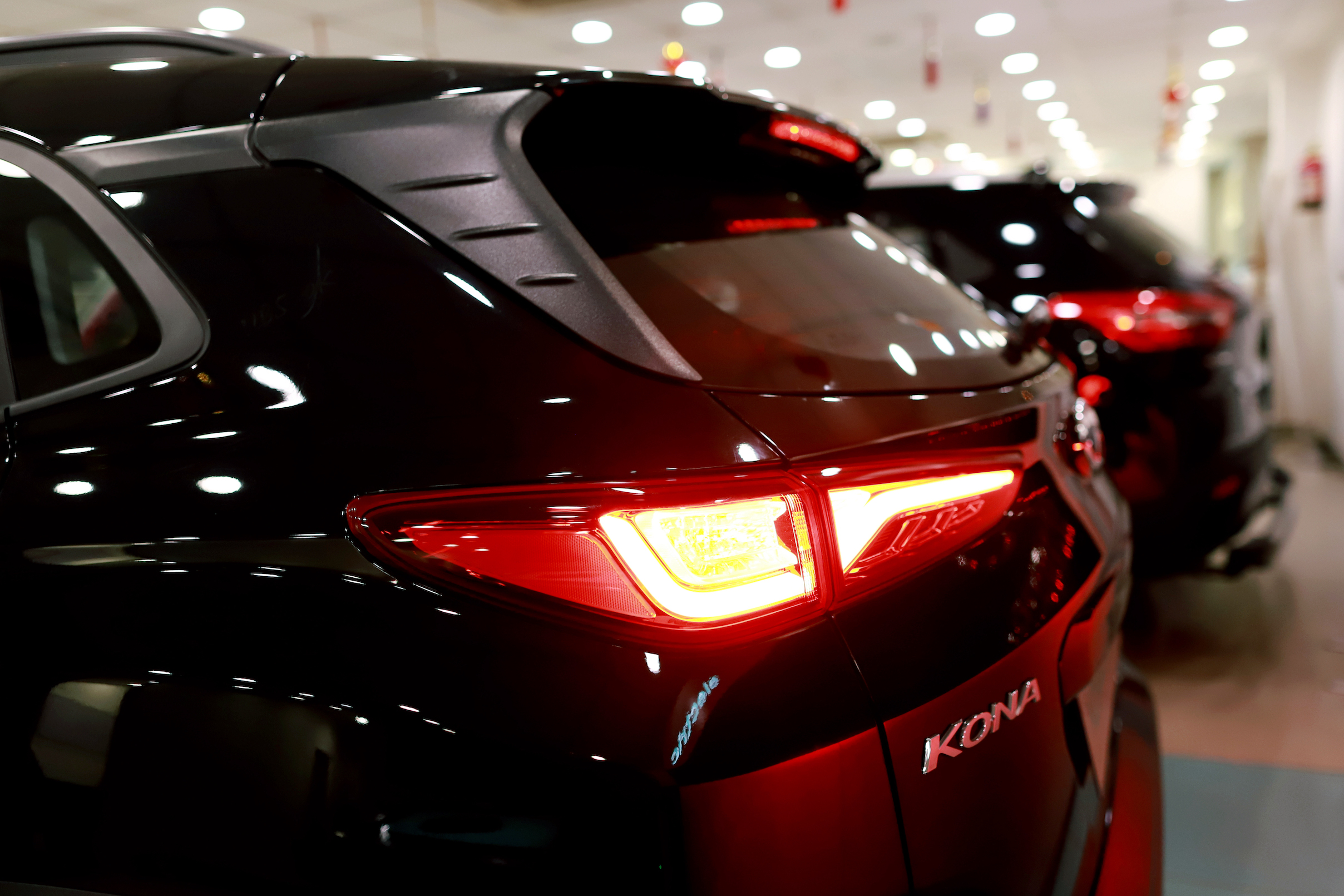 A Hyundai Motor Co. Kona electric vehicle stands on display with other vehicles at the company's Koncept Hyundai showroom in New Delhi