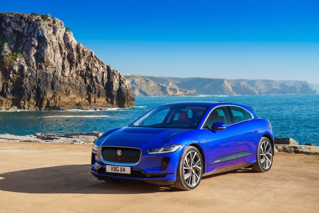 An image of a Jaguar I-Pace parked by the sea.