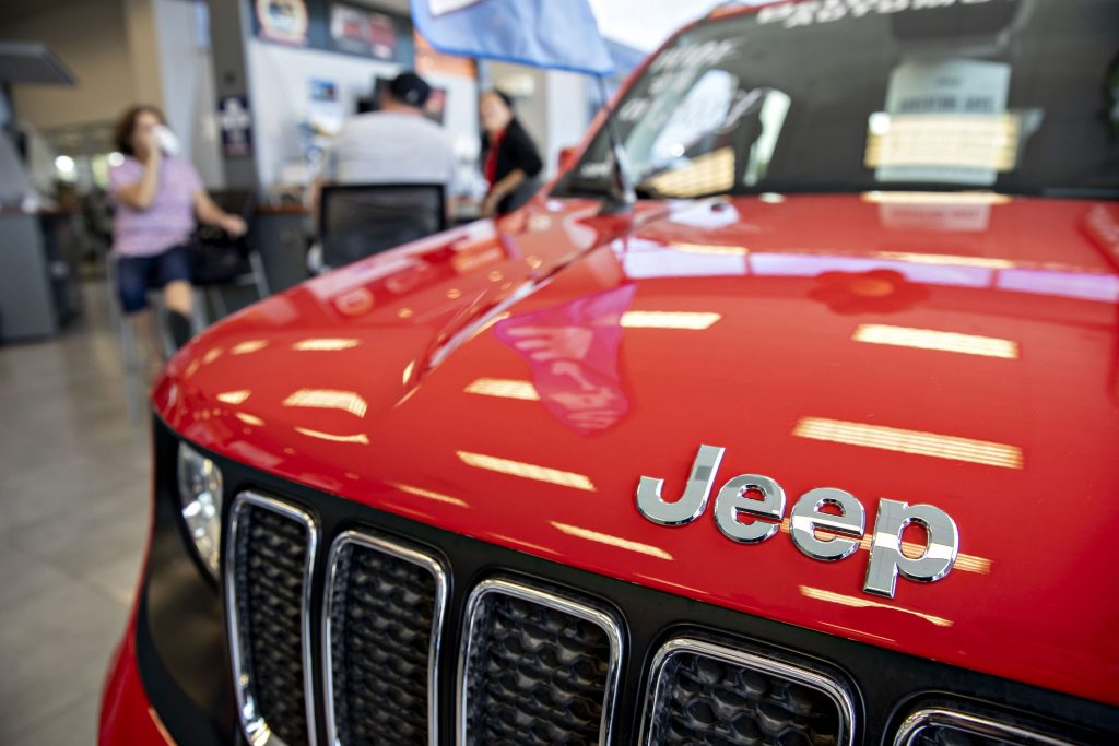A Fiat Chrysler Automobiles NV red 2019 Jeep Renegade sports utility vehicle (SUV) is displayed at a car dealership