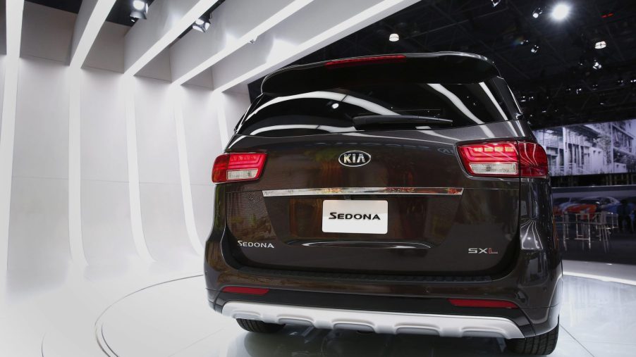 A Kia Motors Corp. 2015 Sedona minivan is displayed during the 2014 New York International Auto Show from the rear of the vehicle