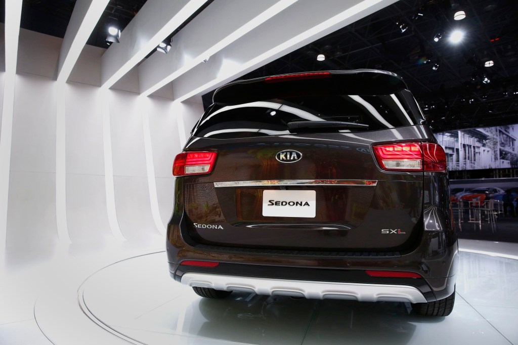 A Kia Motors Corp. 2015 Sedona minivan is displayed during the 2014 New York International Auto Show from the rear of the vehicle