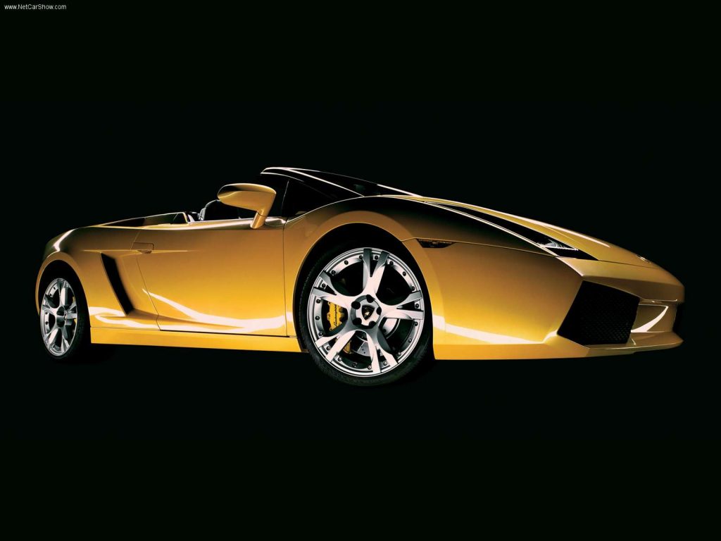 An image of a yellow Lamborghini Gallardo in a studio.