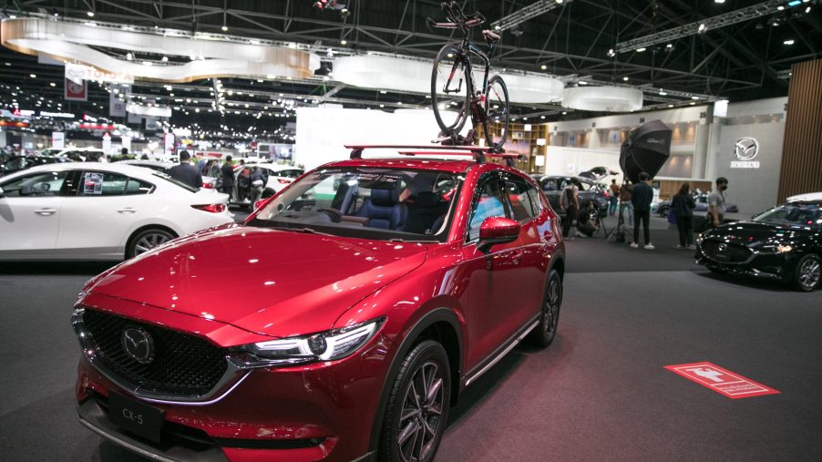 A red Mazda Cx-5 on display at an auto show