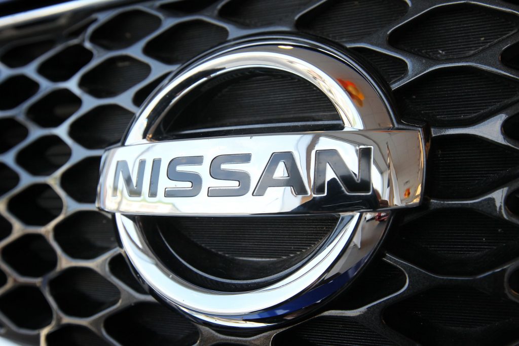 A Nissan Frontier grill shines on the front of the truck