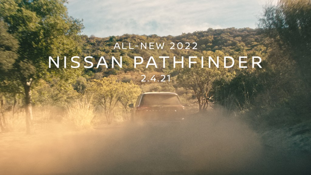 The new 2022 Nissan Pathfinder hidden by a cloud of dust