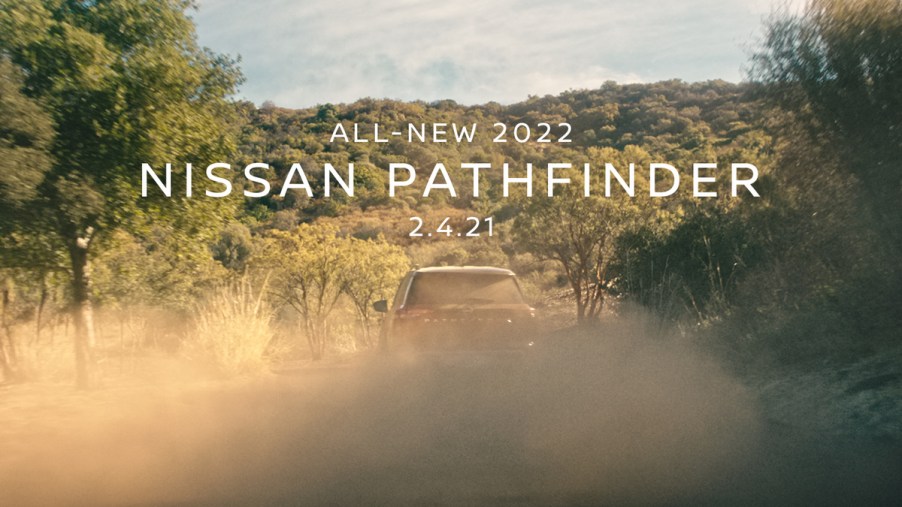 A 2022 Nissan Pathfinder hidden by a cloud of dust