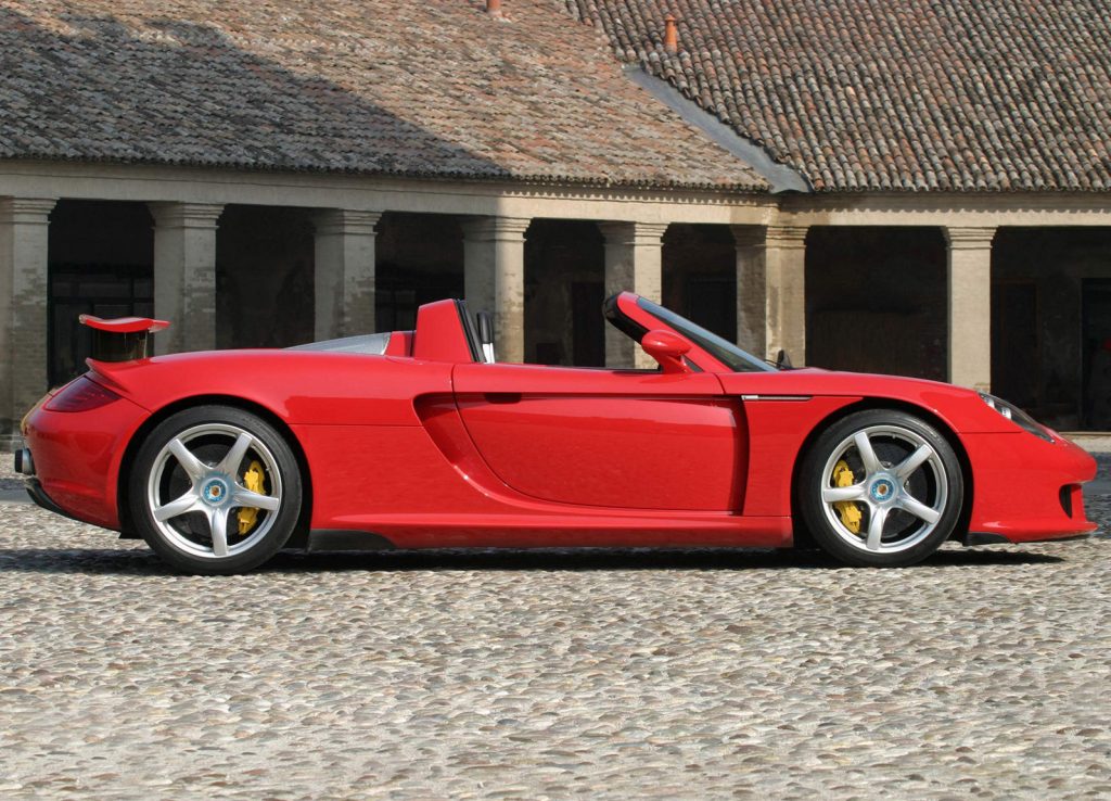 An image of a Porsche Carrera GT parked outside.