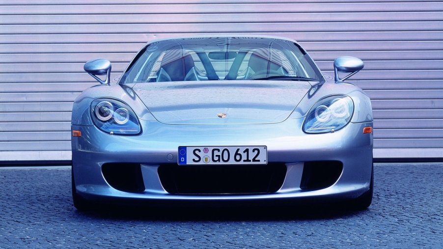 An image of a Porsche Carrera GT parked outside.