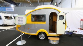 A silver-and-yellow teardrop camper at the Caravan Salon Duesseldorf expo at the fairgrounds on September 4, 2014, in Duesseldorf, Germany.