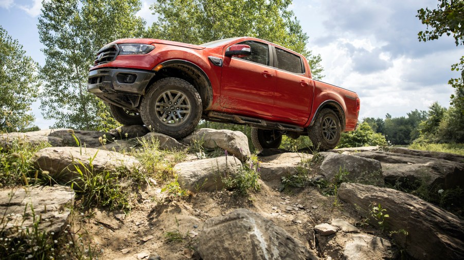 The 2021 Ford Ranger equipped with the Tremor package crawling over rocks