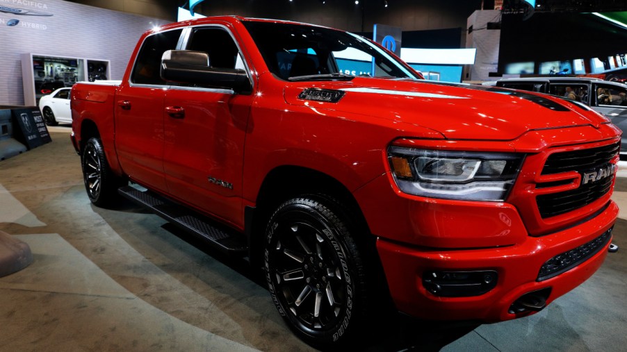 A red 2020 Ram 1500 on display at an auto show