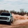 The 2021 Ford F-250 Roush kicking up sand