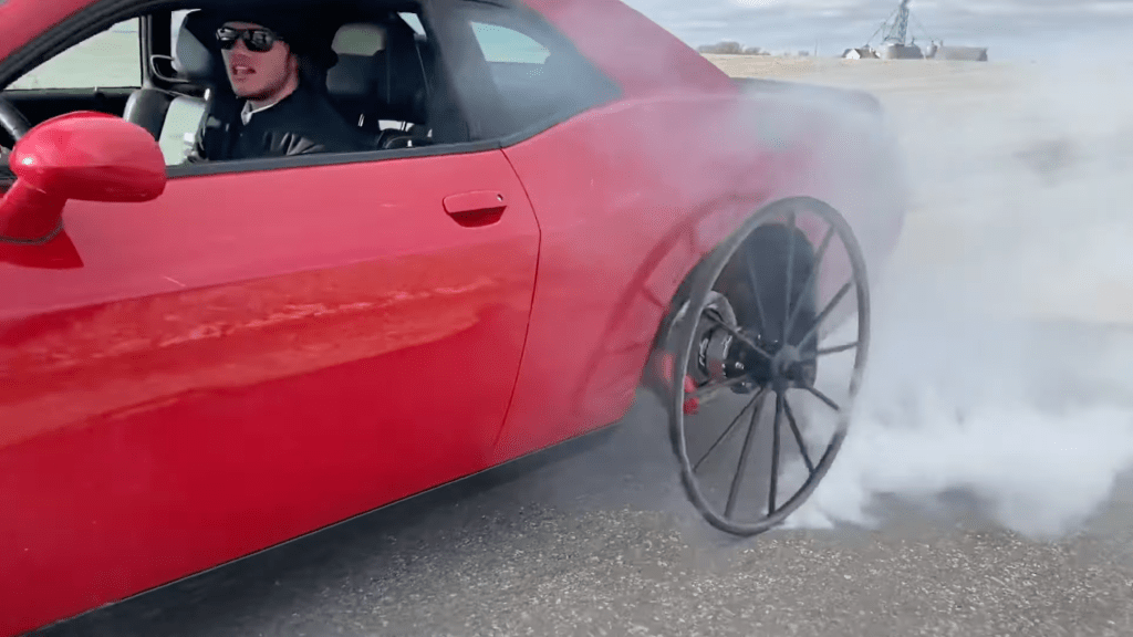 An image of a Dodge Challenger Hellcat with Buggy Wheels.