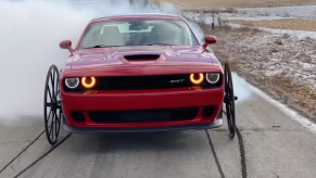 An image of a Dodge Challenger Hellcat with Buggy Wheels.