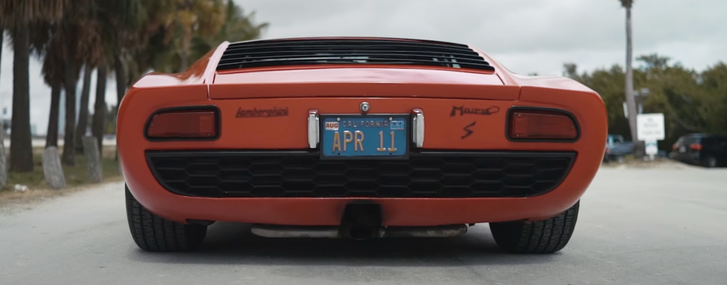 An image of a Lamborghini Miura S driving through Miami, FL.