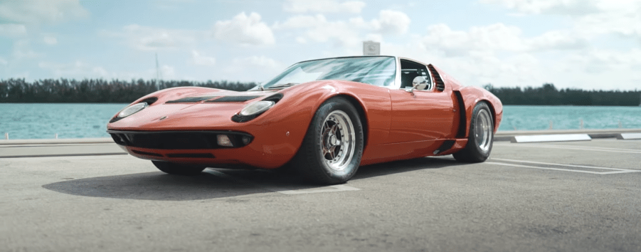 An image of a Lamborghini Miura S driving through Miami, FL.