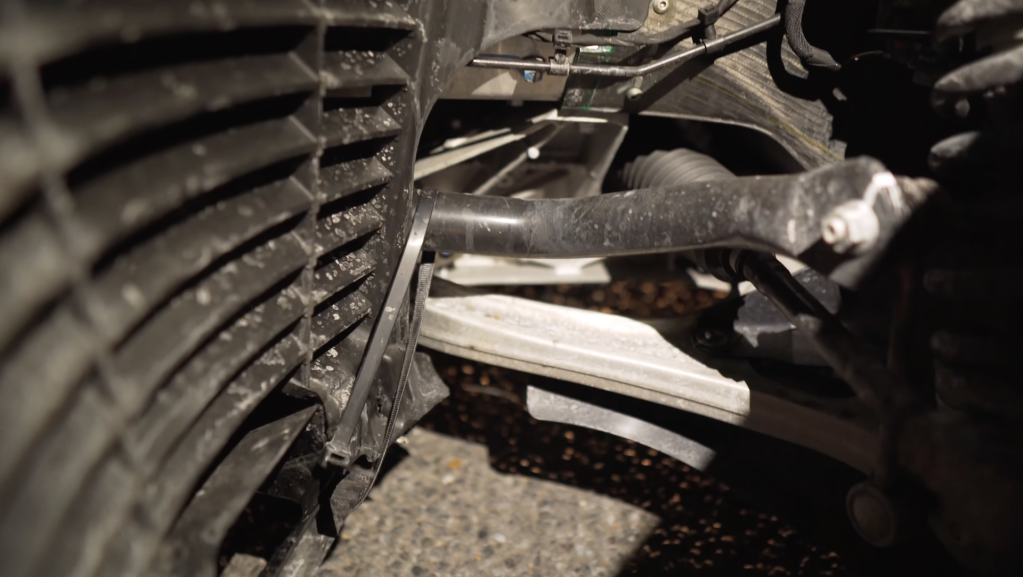 An image of a McLaren 600LT showing damage held together by zip ties.