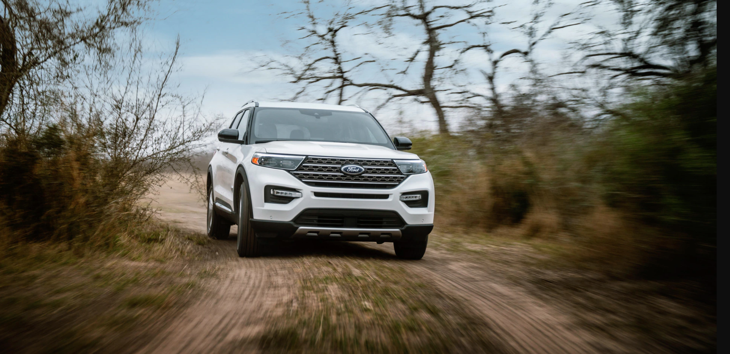 The 2021 Ford Explorer King Ranch edition driving on a dirt road