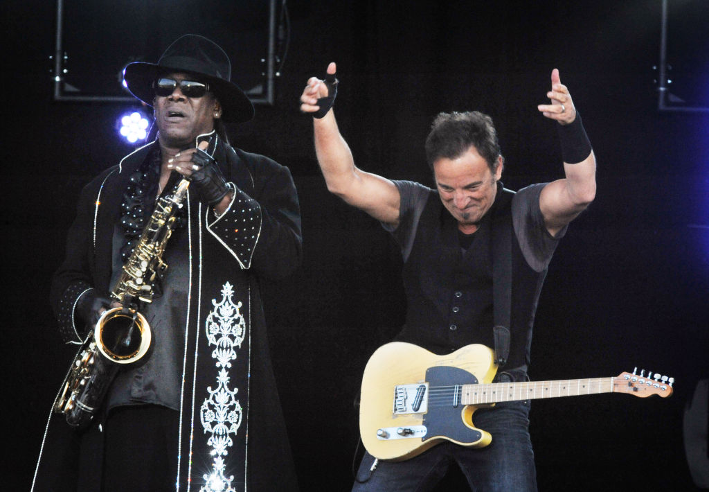 Musician Bruce Springsteen giving two thumbs up on stage