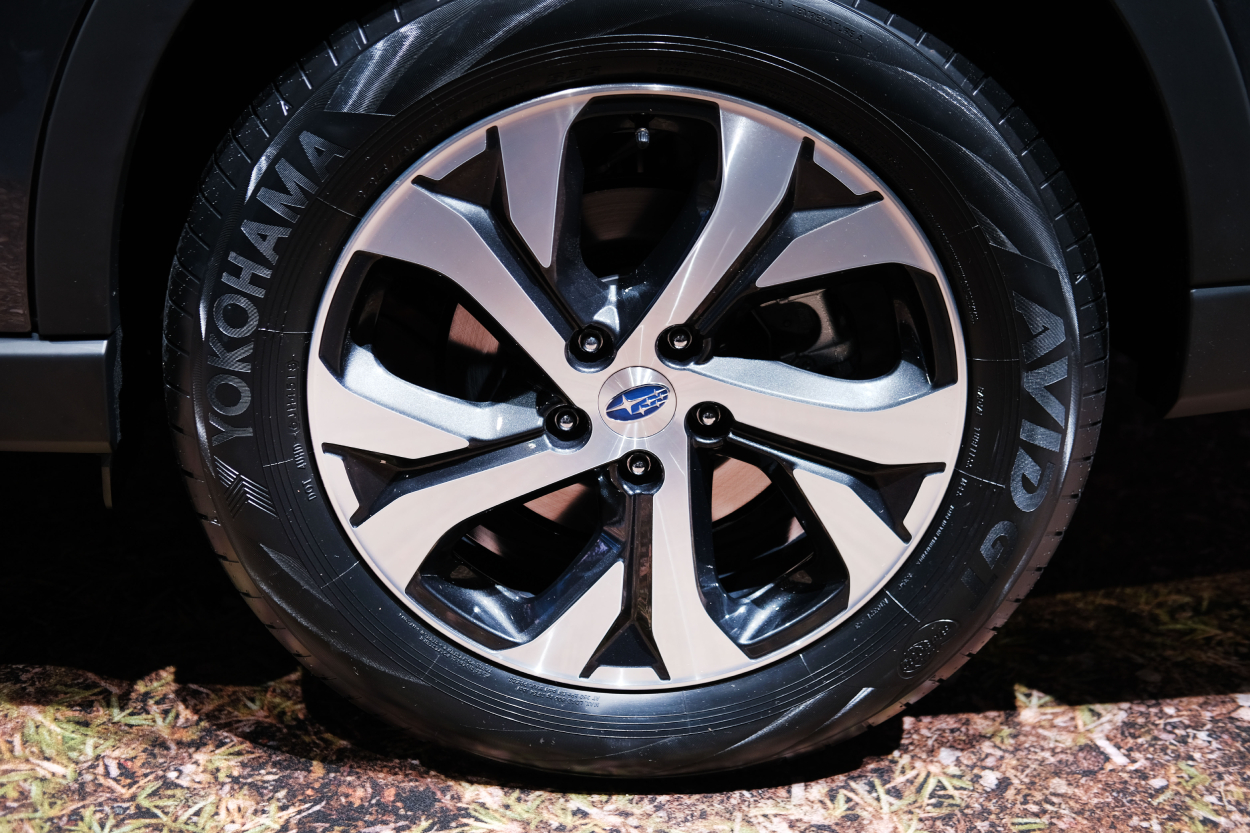 The tire on a Subaru Outback displayed at an auto show