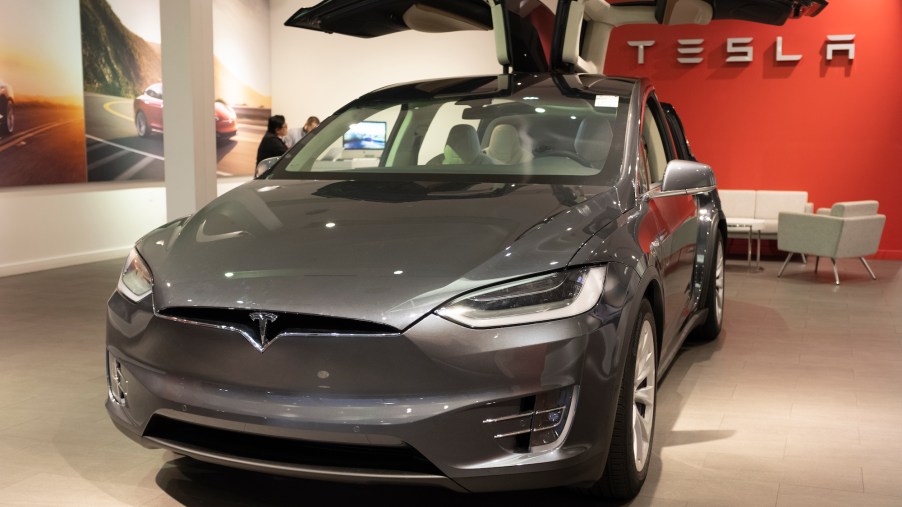 A metallic dark-gray Tesla Model X on display at a Tesla store in Palo Alto, California on October 3, 2019.