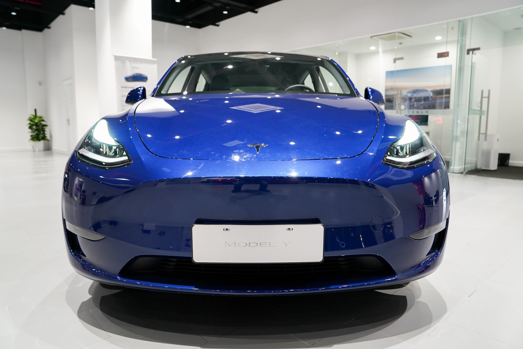 A blue Tesla Model Y vehicle is pictured at a Tesla Center in Shanghai on Jan 18, 2021