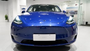 A blue Tesla Model Y vehicle is pictured at a Tesla Center in Shanghai on Jan 18, 2021