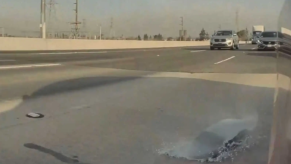 Tesla glass explodes onto freeway