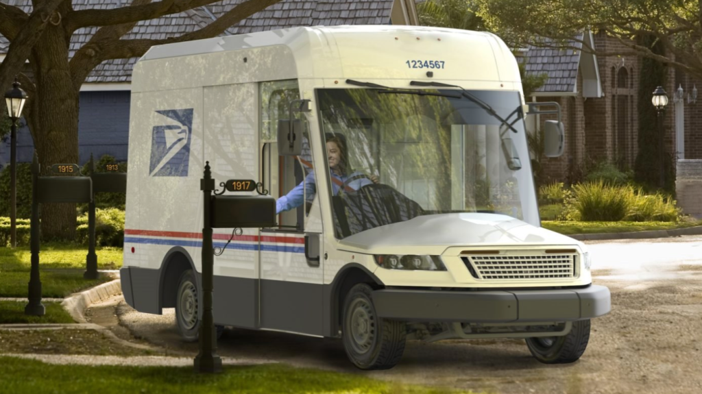 2023 USPS Oshkosh mail truck delivering mail in neighborhood