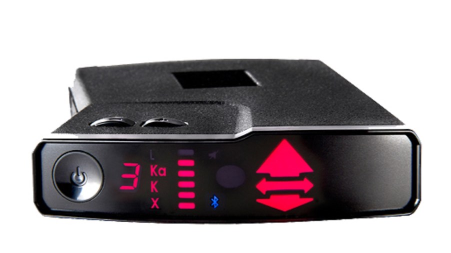 A black Valentine V1 Gen2 radar detector with its Bluetooth and red directional arrows lit up