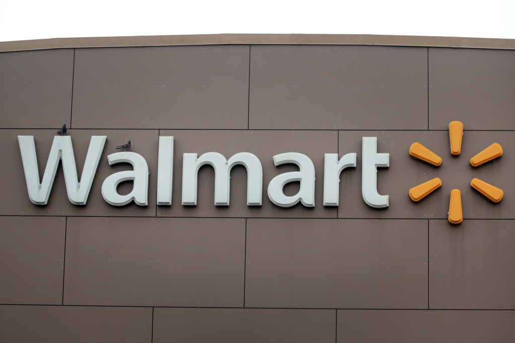 A sign hangs outside of a Walmart store in Chicago, Illinois. 