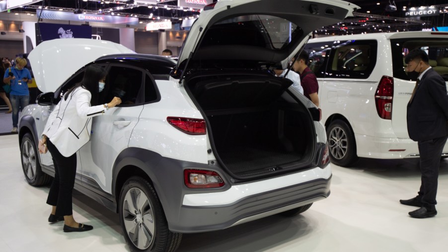 A white Hyundai Kona on display at an auto show