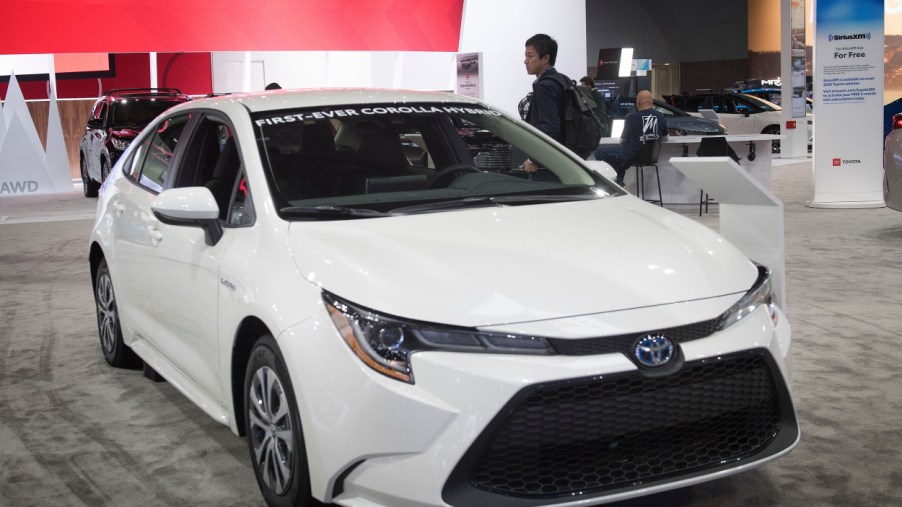A white Toyota Corolla Hybrid on display at